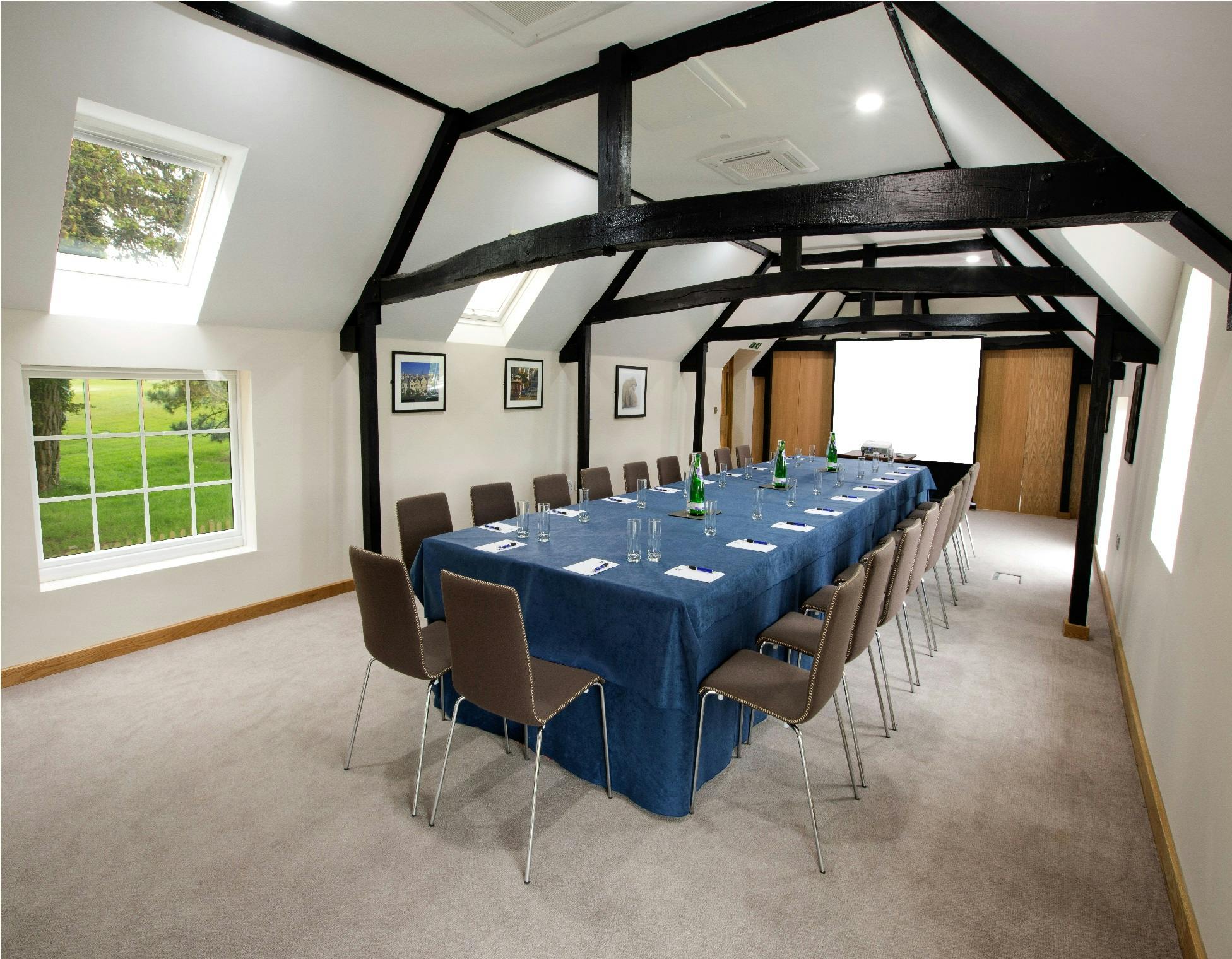 Clockhouse Suite meeting room with natural light, ideal for workshops and professional gatherings.