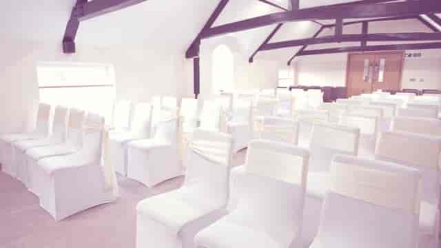 Elegant event space with draped chairs at Sandford Springs Hotel for weddings.