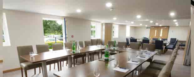 "Well-lit Leaderboard Suite at Sandford Springs for professional meetings and events."
