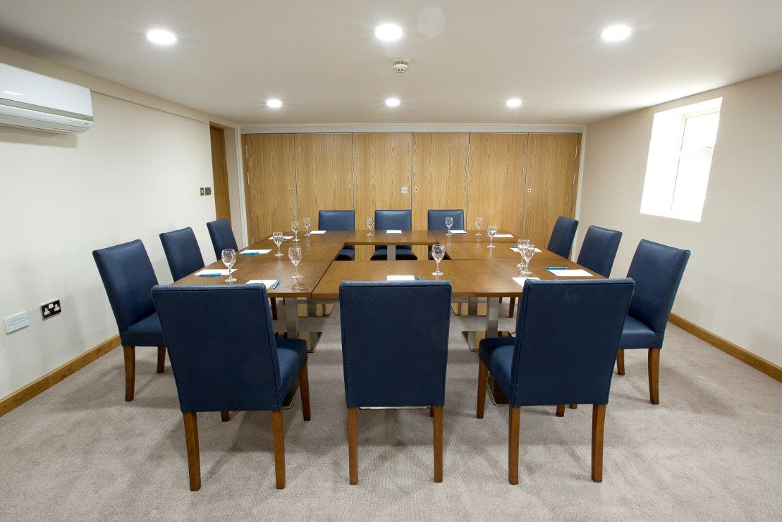 Davies Suite meeting room at Sandford Springs Hotel, ideal for board meetings and events.