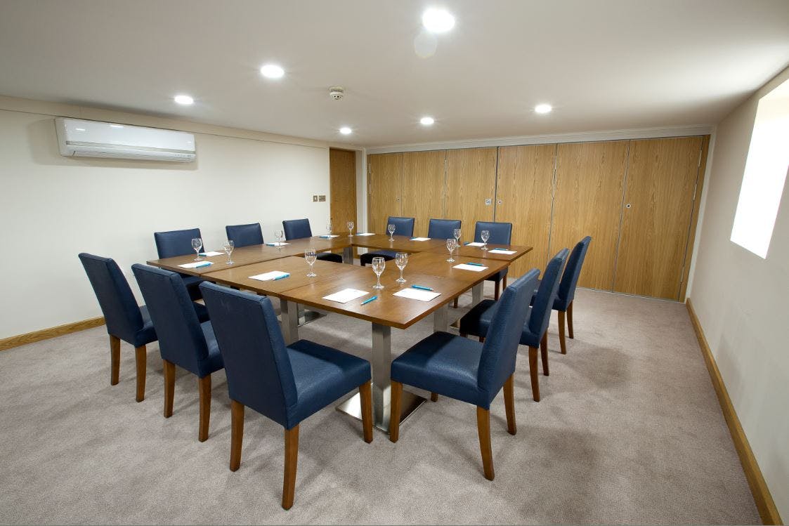 Davies Suite meeting room at Sandford Springs Hotel, ideal for board meetings and workshops.