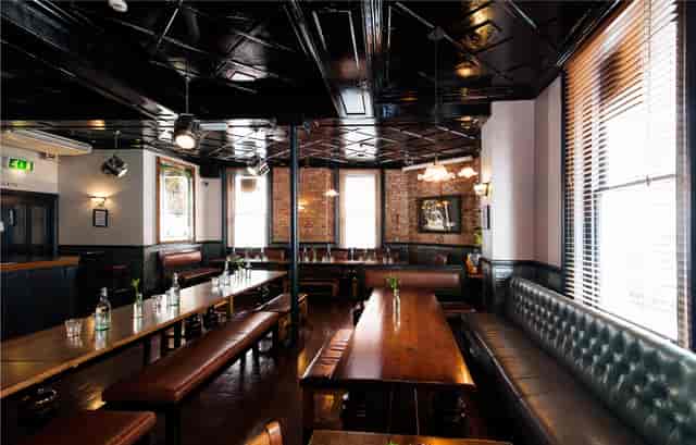 Stylish Upstairs Private Bar with leather seating, perfect for corporate events and gatherings.