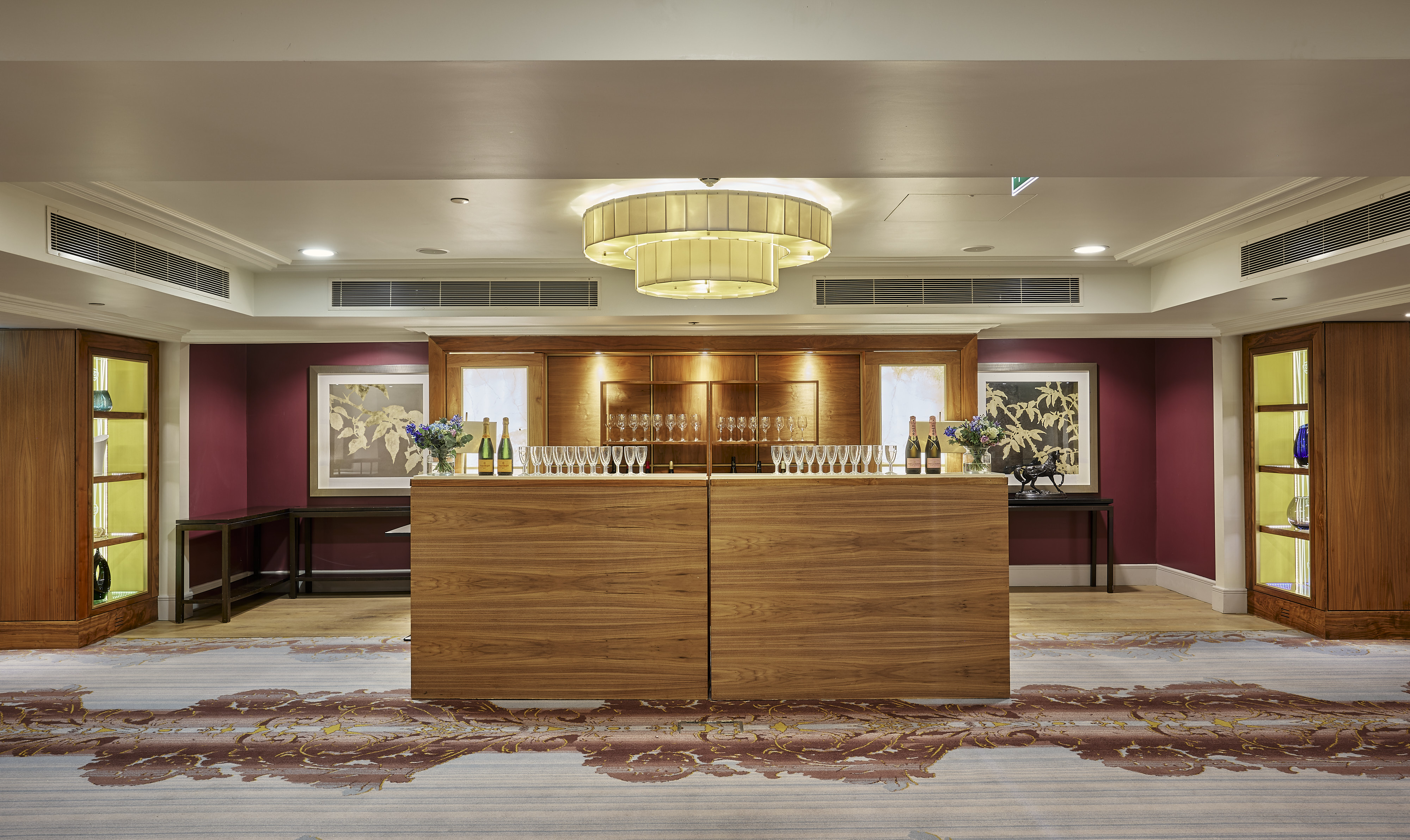 Mayfair Suite at Sofitel London: elegant event space with modern chandelier, ideal for networking. - Banner