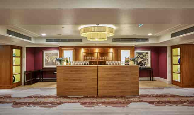Mayfair Suite at Sofitel London: elegant event space with modern chandelier, ideal for networking.