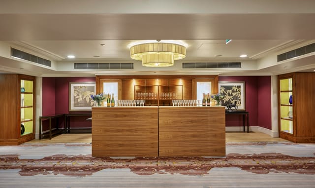 Mayfair Suite at Sofitel London: elegant event space with modern chandelier, ideal for networking.
