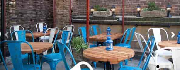 The Belle Bar outdoor bistro tables, ideal for casual networking and social mixer events.