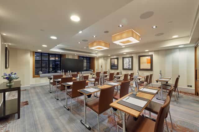 Modern meeting room at Sofitel London St James, perfect for corporate events and training.