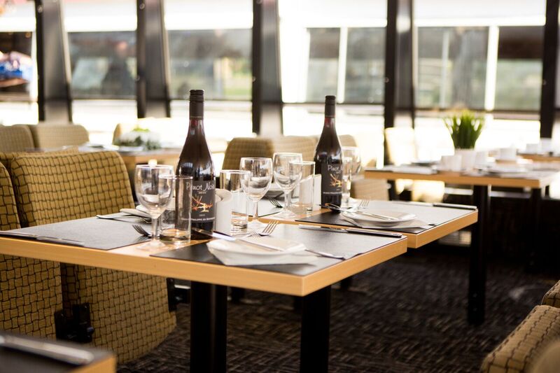 Elegant dining setup on M.V. Millennium Time for corporate events and gatherings. - Banner