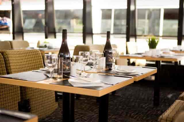Elegant dining setup on M.V. Millennium Time for corporate events and gatherings.