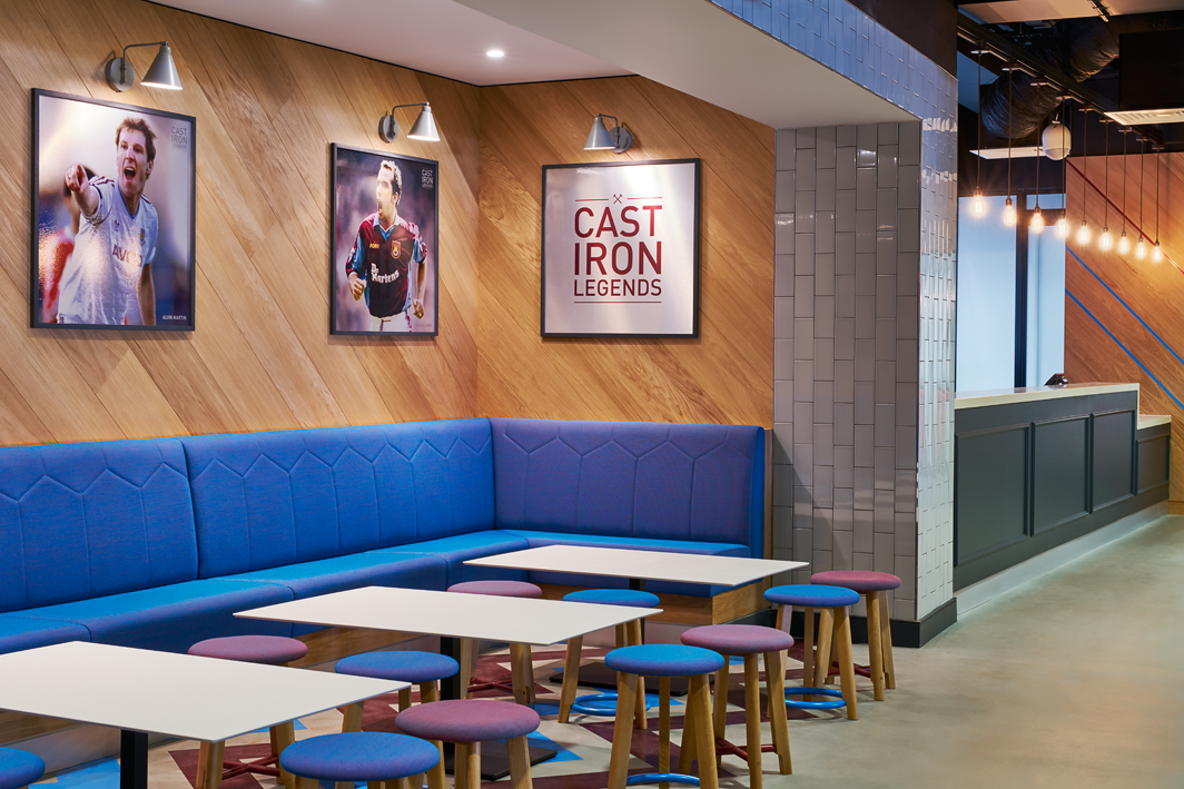 Modern event space at The Boleyn, featuring vibrant seating for networking events. - Banner