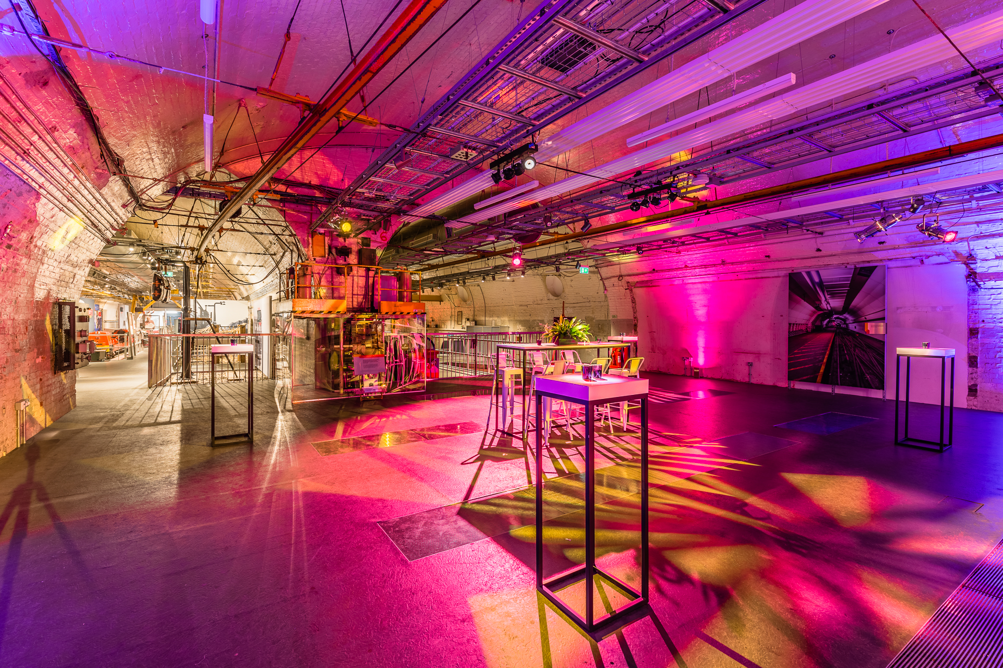 Mail Rail event space in The Postal Museum with vibrant lighting for networking and gatherings.