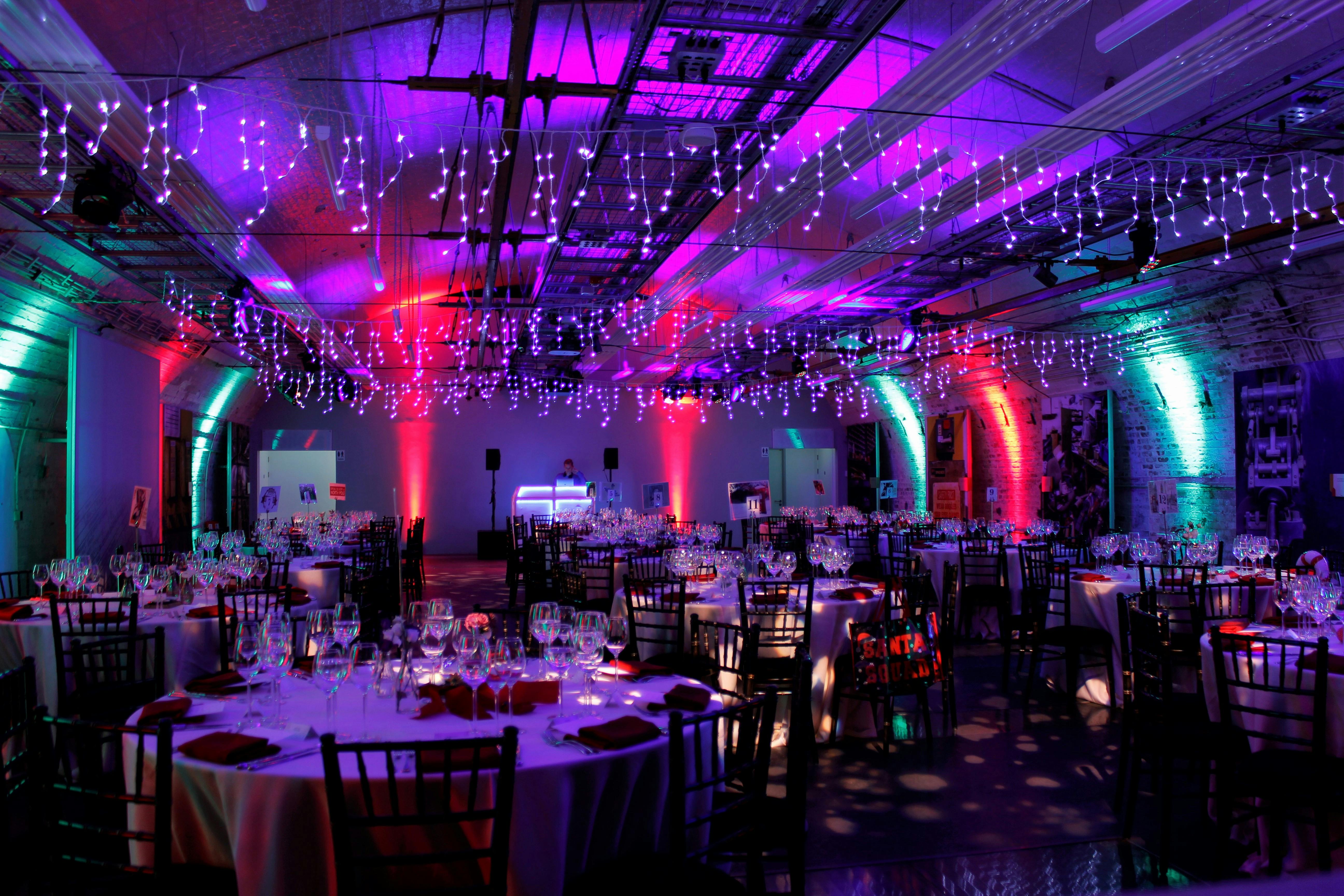 Elegant round tables in Mail Rail, The Postal Museum, ideal for corporate events and celebrations.