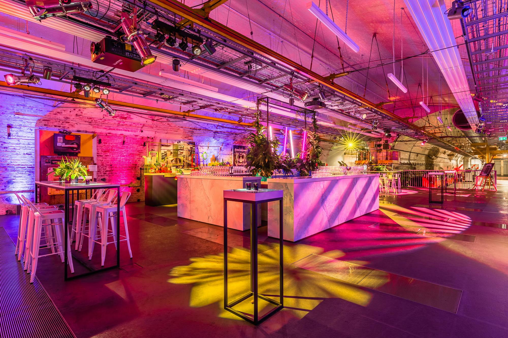 Mail Rail event space in The Postal Museum with vibrant lighting for networking events.