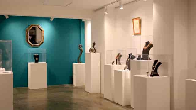 Modern exhibition space at Sunny Art Centre showcasing elegant jewelry and art.