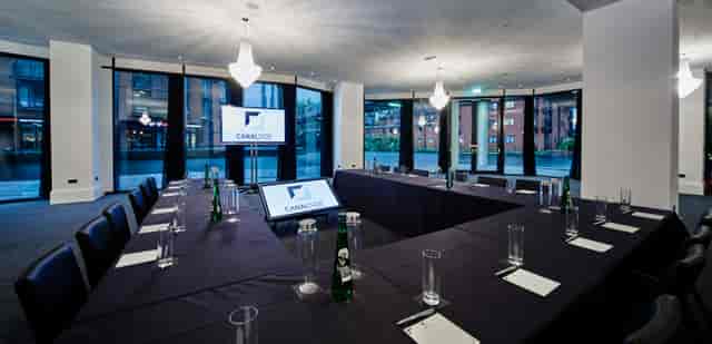 Corporate meeting room with U-shaped table setup for events at Canalside.