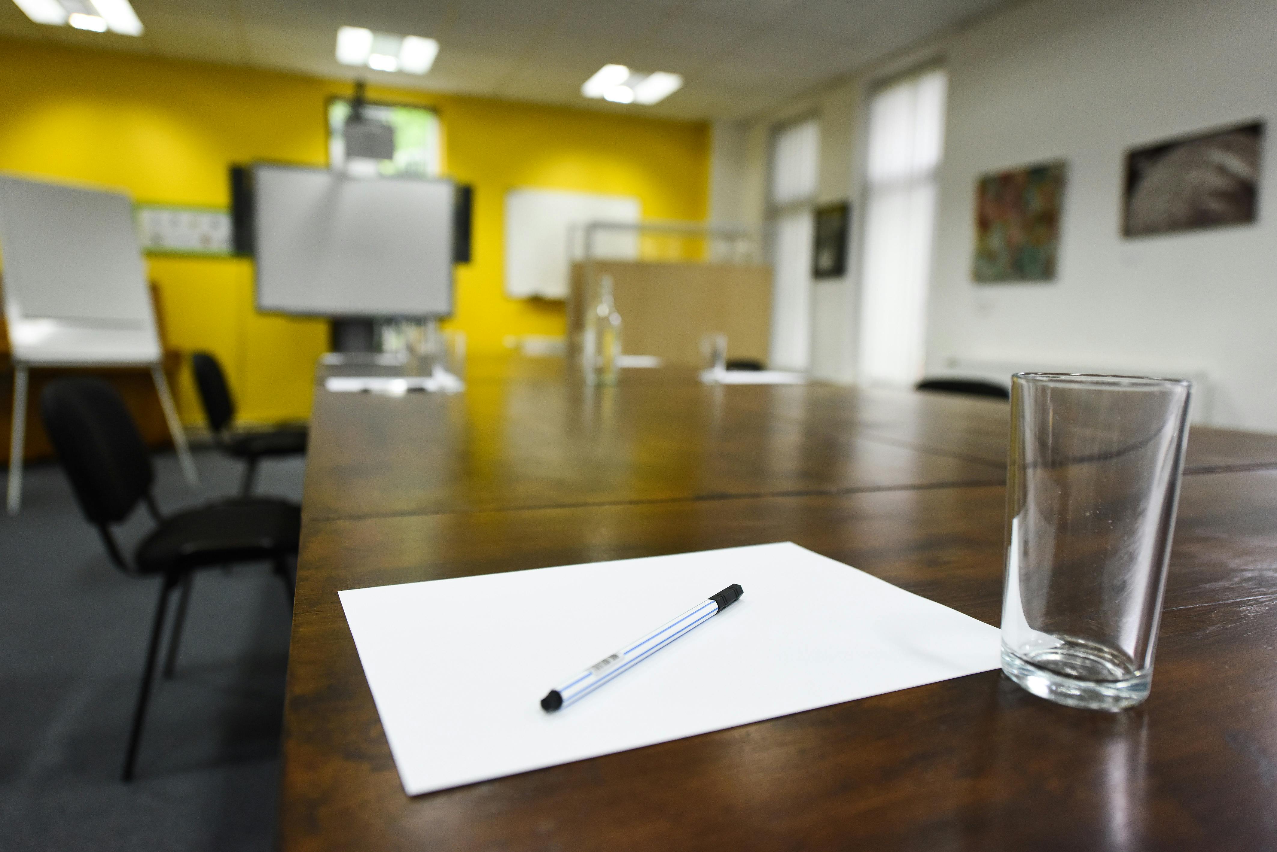 Meeting Room at The Brain Charity with wooden table, ideal for brainstorming sessions.