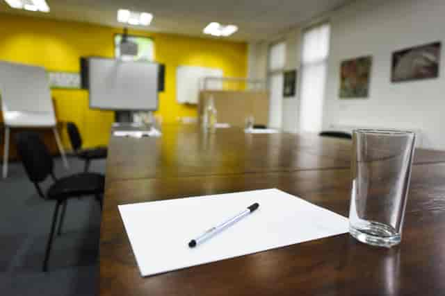 Meeting Room at The Brain Charity with wooden table, ideal for brainstorming sessions.