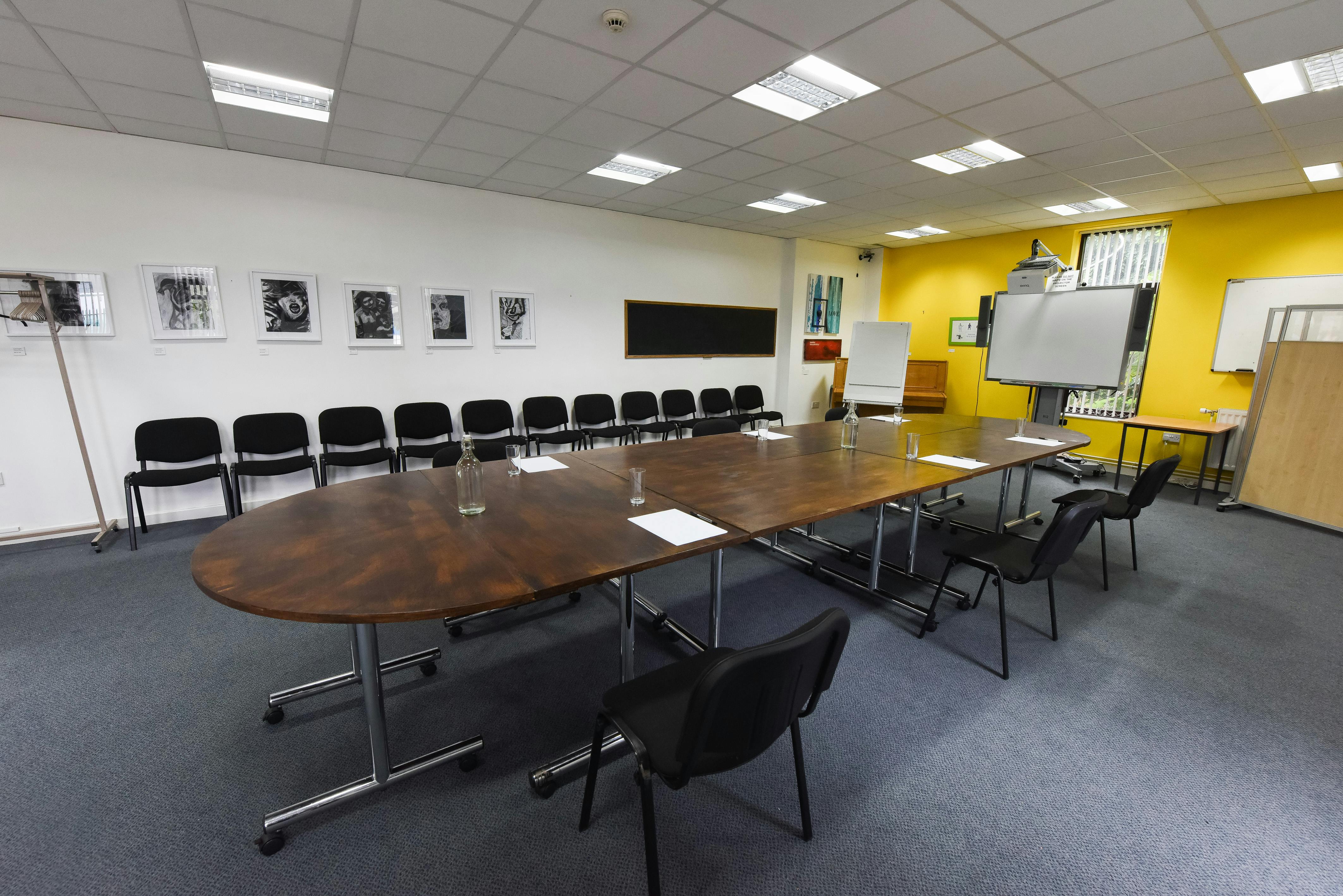Meeting Room at The Brain Charity with oval table for collaborative brainstorming sessions.