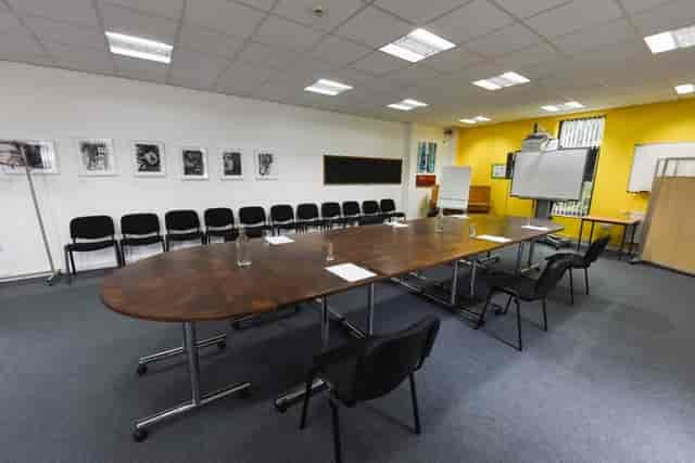 Meeting Room at The Brain Charity with oval table for collaborative brainstorming sessions.