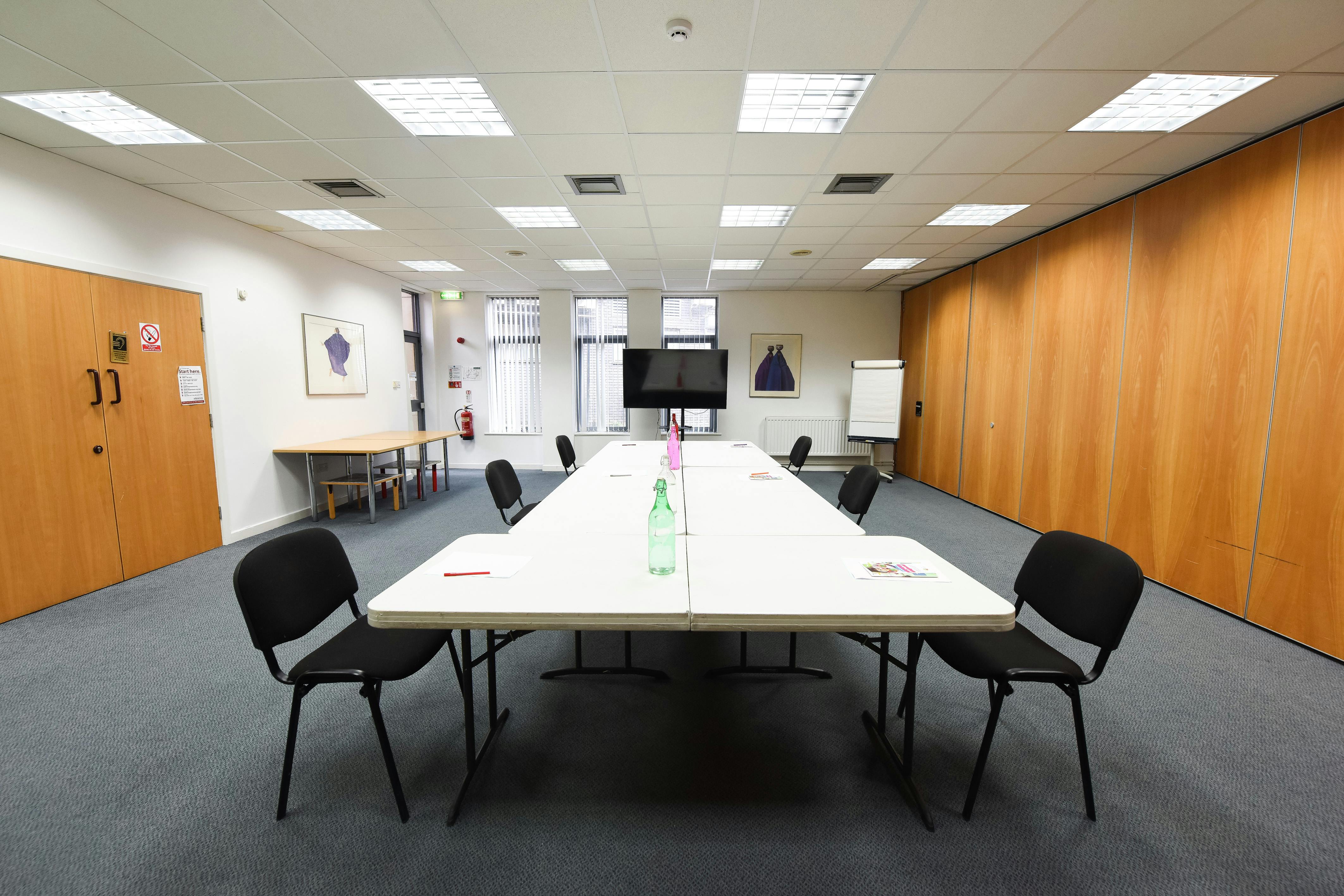 Seminar Room at The Brain Charity, featuring a long table for collaborative meetings.