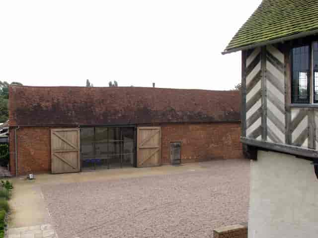 Rustic barn venue at Blakesley Hall, perfect for intimate gatherings and events.