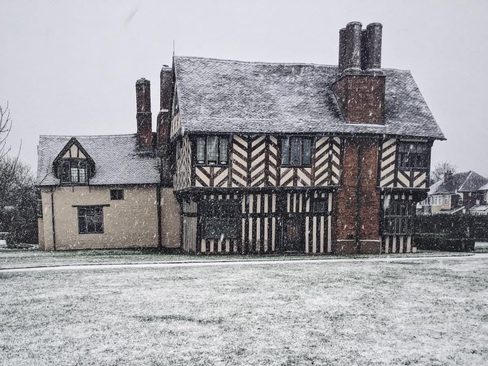 Great Hall at Blakesley Hall, snow-covered venue for winter events and holiday parties.