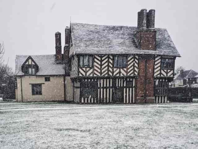 Great Hall at Blakesley Hall, snow-covered venue for winter events and holiday parties.
