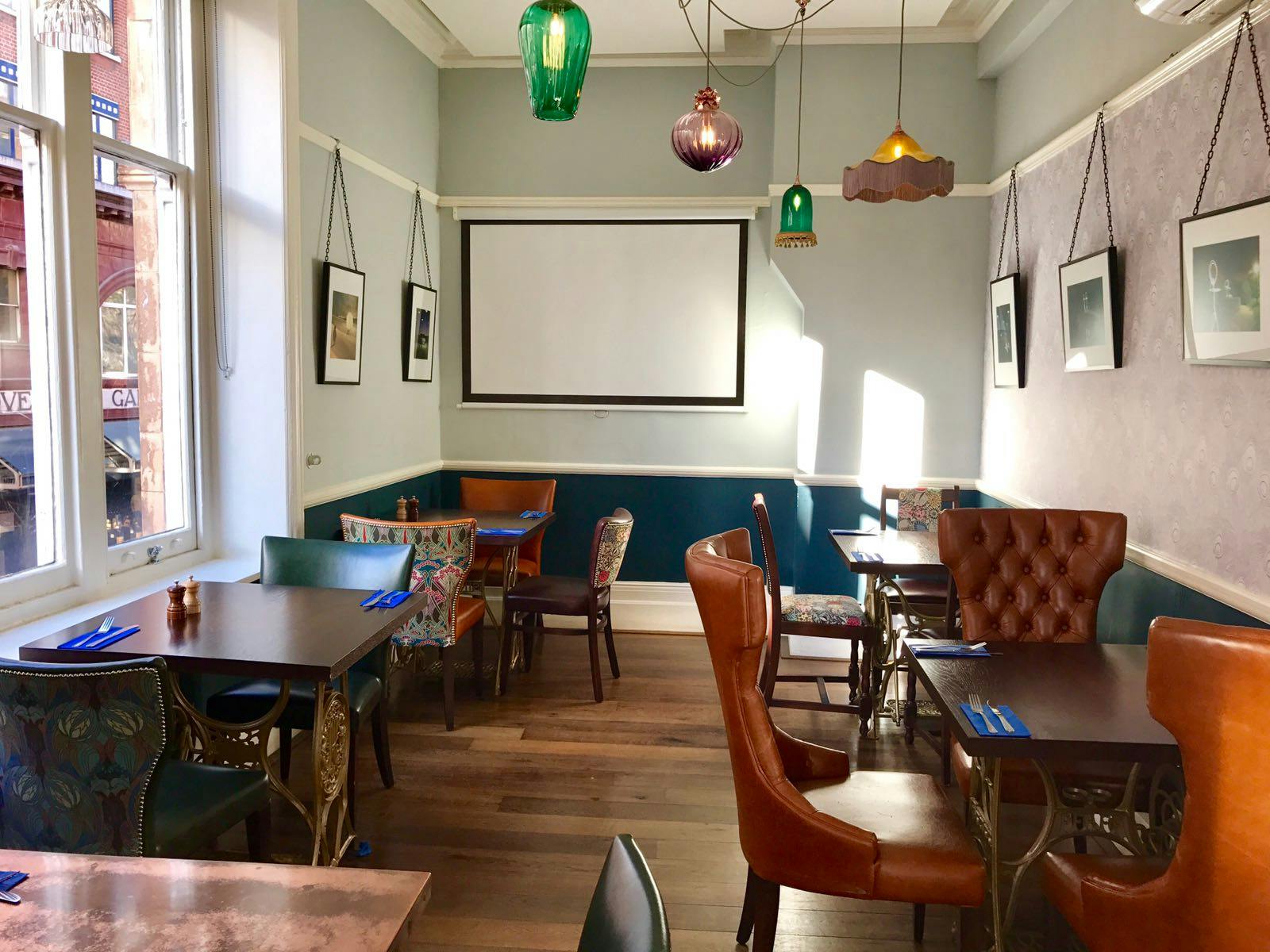 Cozy Nags Head conference room with eclectic seating, ideal for meetings and events.