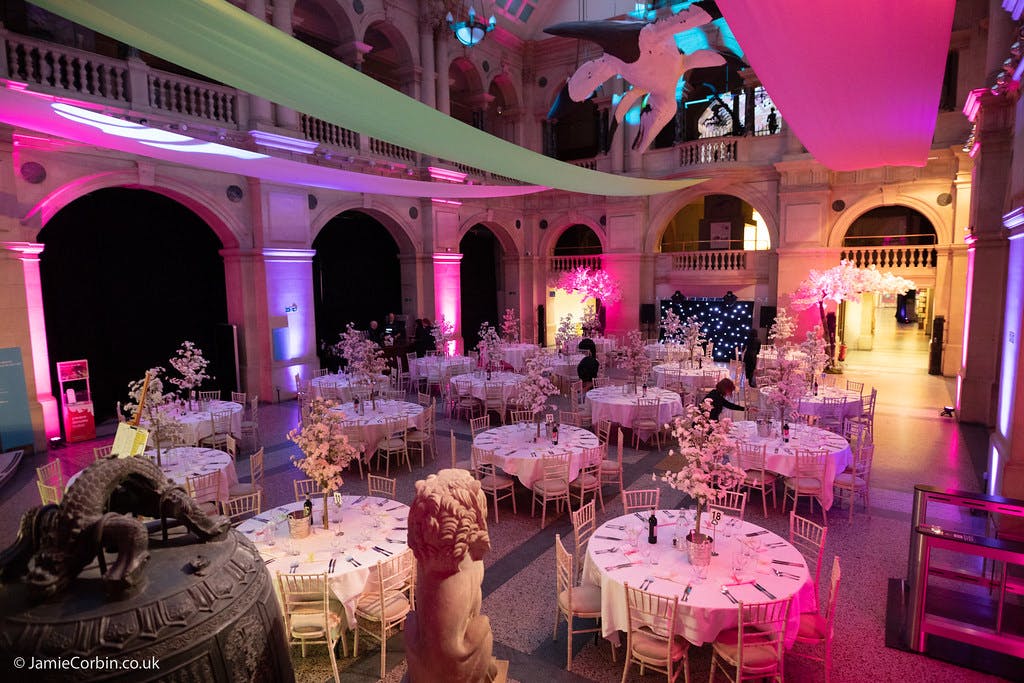 Elegant event space at Bristol Museum with round tables, ideal for gala dinners and corporate events.