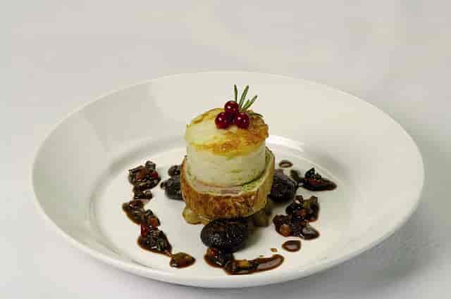 Elegant dish presentation at The National Motor Museum for upscale events.