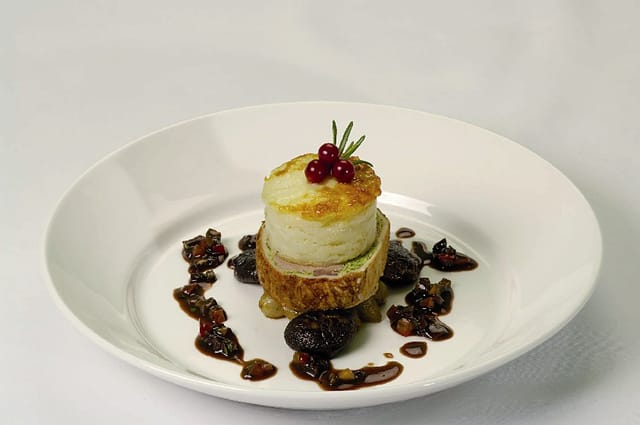 Elegant dish presentation at The National Motor Museum for upscale events.