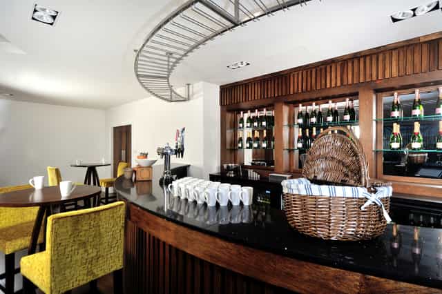 Rowley Suite bar at Leicester City FC, sleek design for events and meetings.