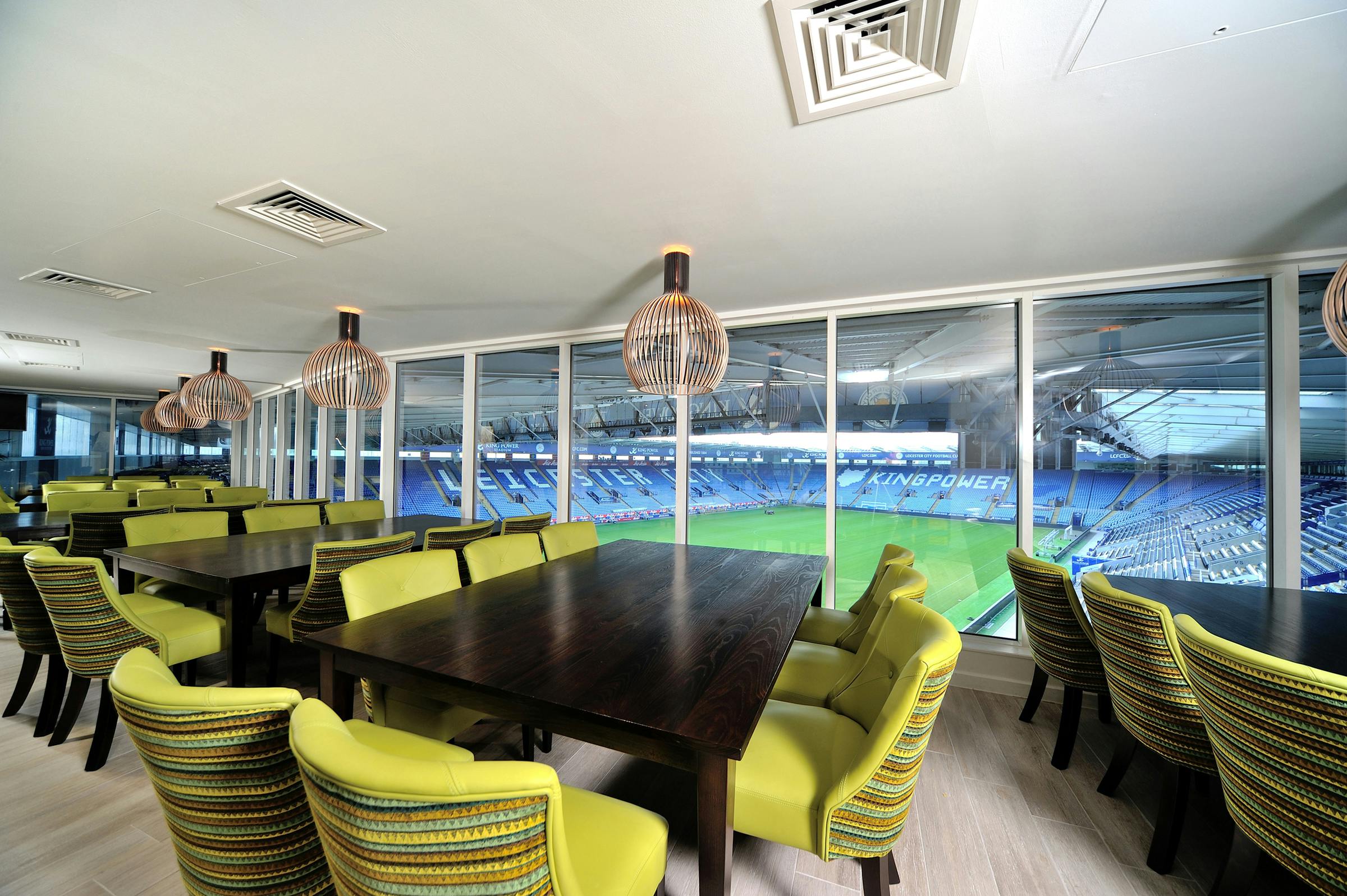 Modern event space at Leicester City FC with vibrant seating, ideal for corporate gatherings.