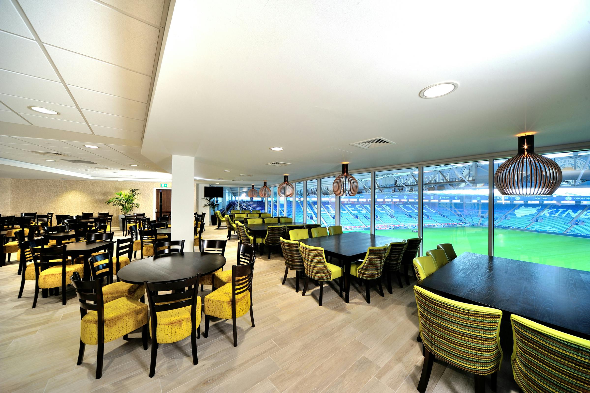 Modern event space at Leicester City FC with stadium view, perfect for corporate gatherings.