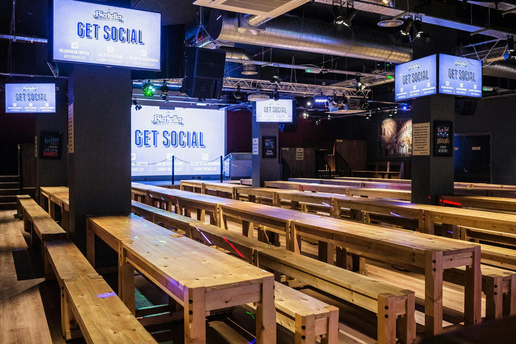 Bierkeller Bar event space with communal tables, ideal for networking and gatherings.