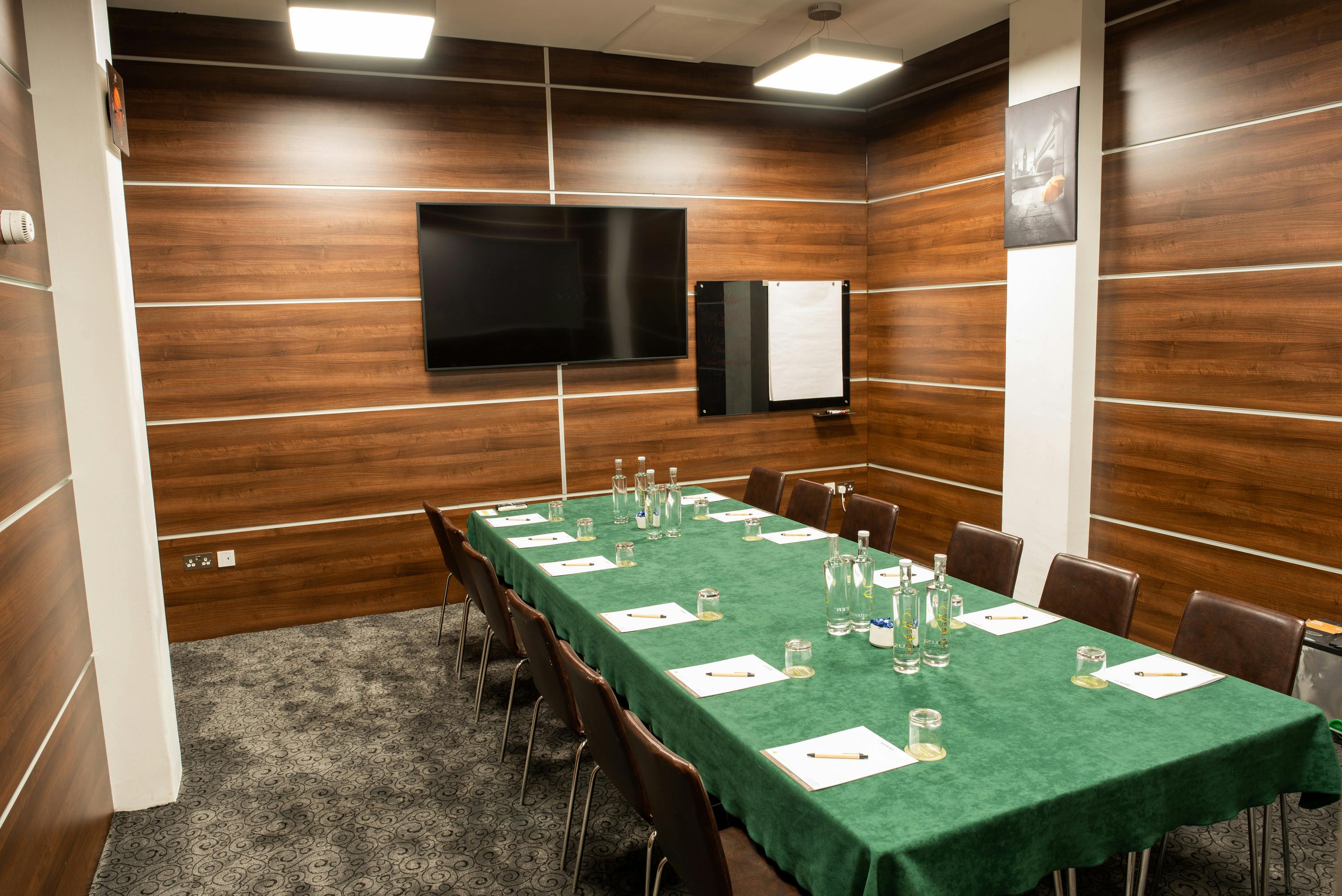 Meeting room at Wesley Euston Hotel, featuring a long table for professional workshops.