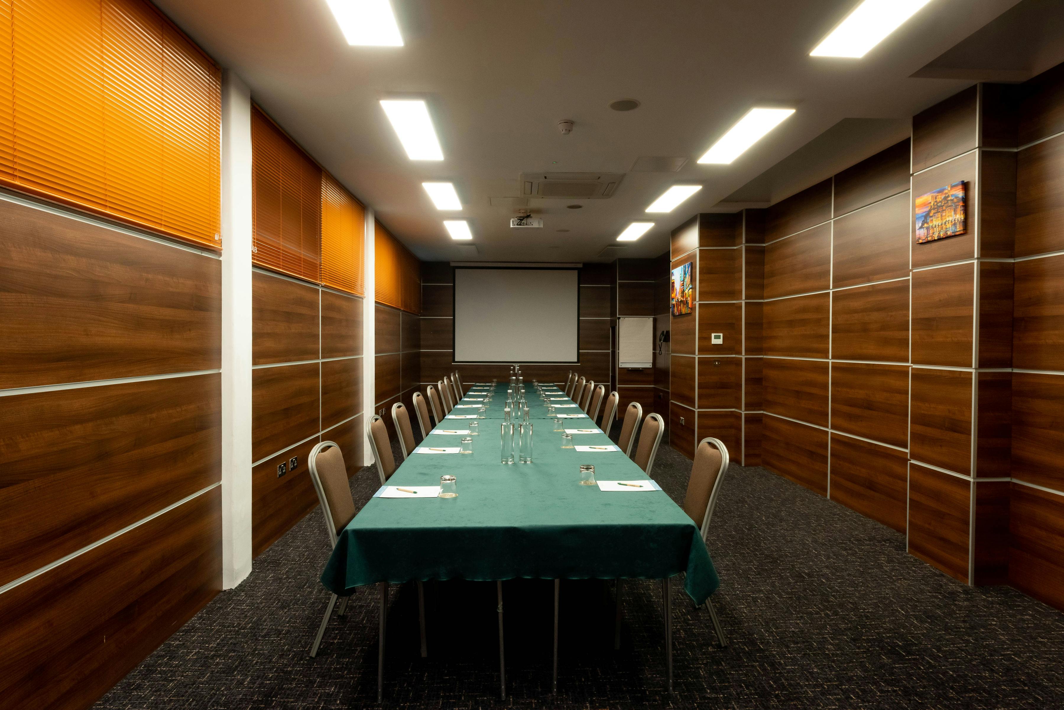 Birmingham conference room with long table, ideal for corporate meetings and workshops.