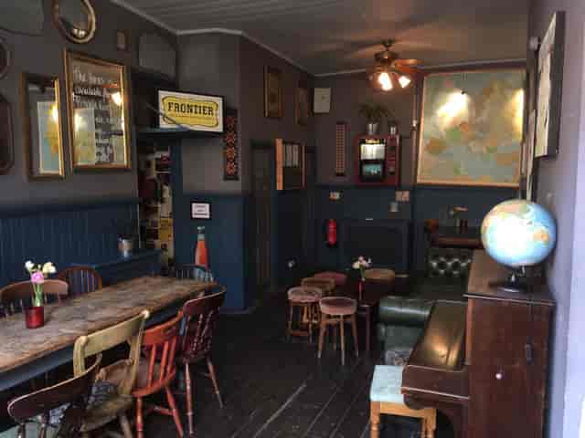 Cozy Whole Pub venue with rustic decor for meetings and gatherings.