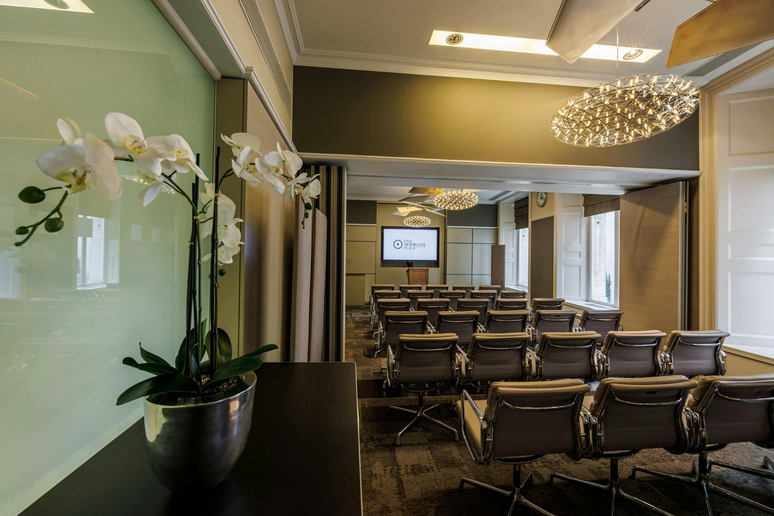 Meeting room at One Moorgate Place with modern seating and elegant lighting for professional events.