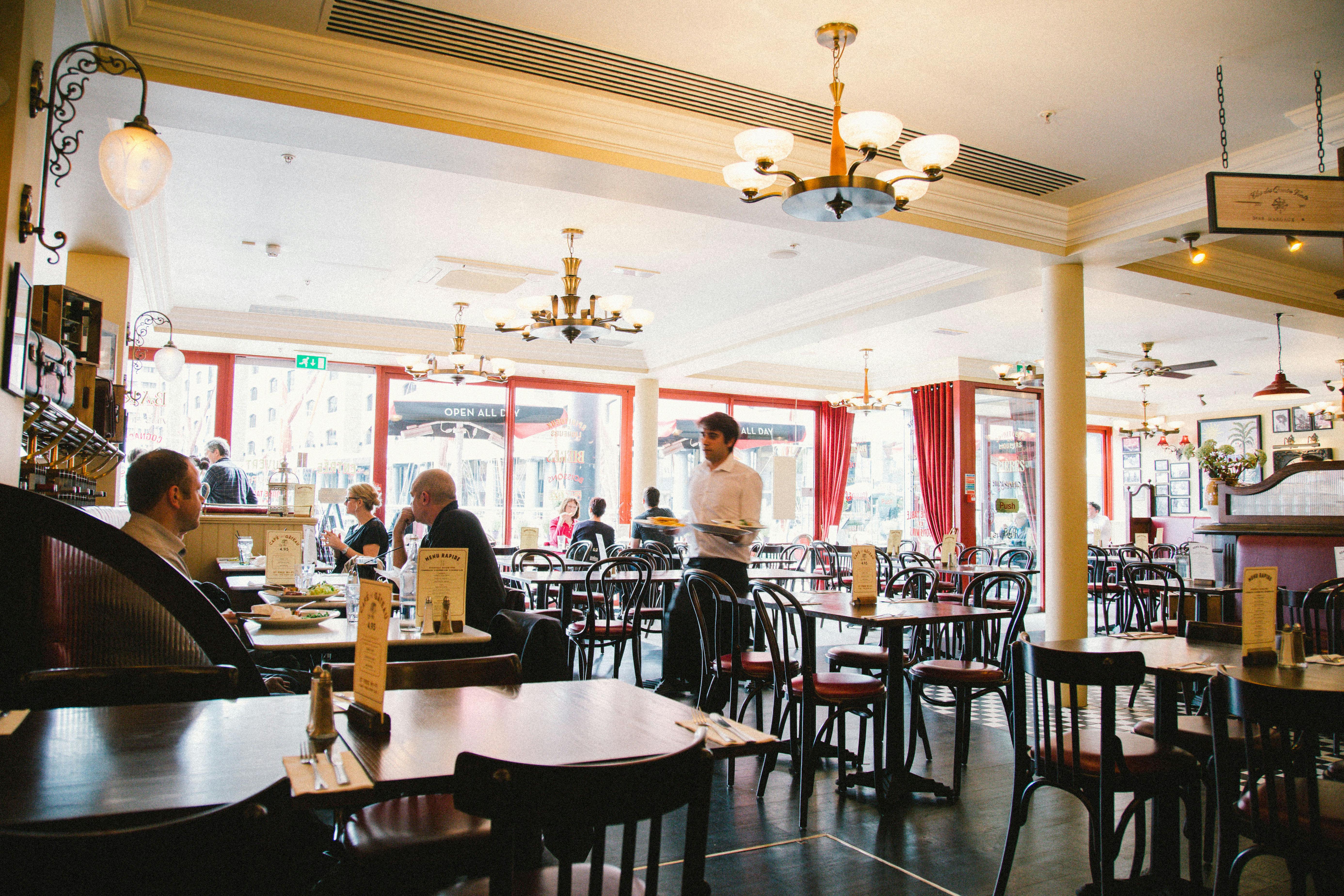 Spacious Café Rouge venue with natural light, ideal for meetings and events.