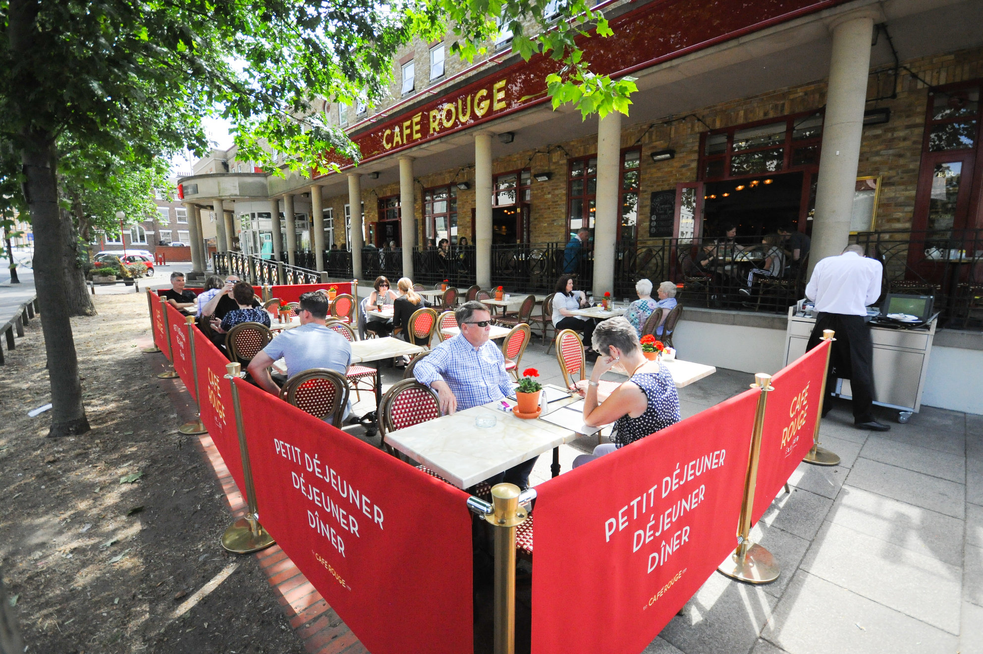 Outdoor dining area at Café Rouge Greenwich, ideal for summer networking events. - Banner