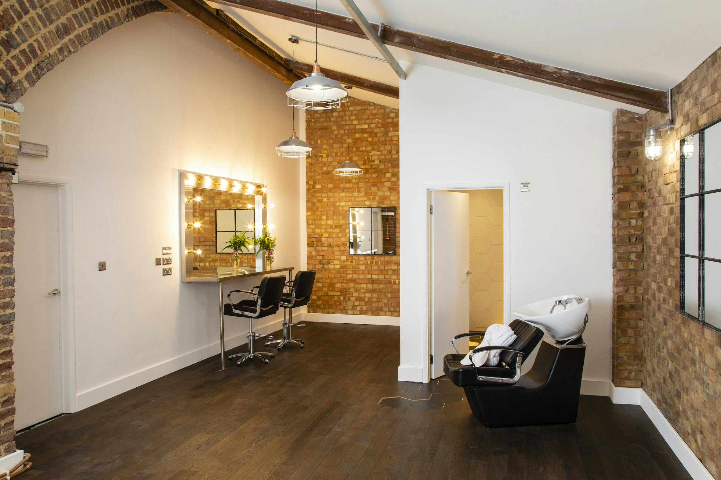 Modern Studio A in Rida Haggerston, ideal for meetings and events with exposed brick.