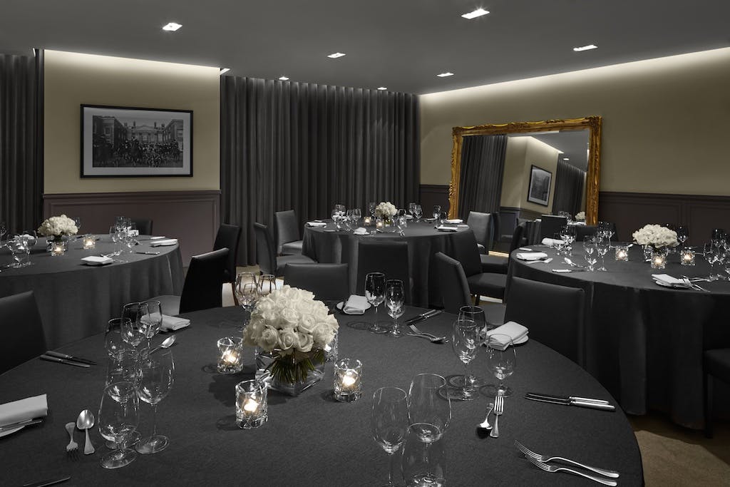 Elegant banquet room at The London EDITION, perfect for corporate events and gatherings.