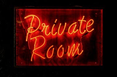 Private Dining Room at The Blues Kitchen Brixton with neon sign, ideal for events and gatherings.