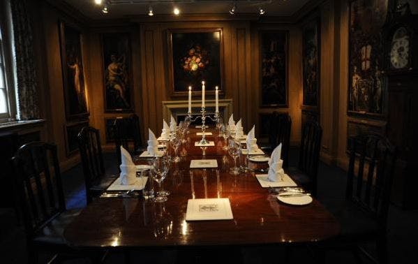 Painted Chamber boardroom with elegant table setup for meetings and dinners.