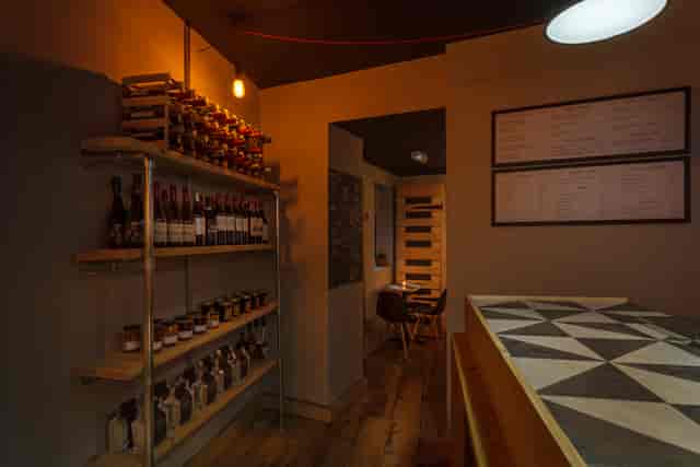 Cozy cafe and bar with warm lighting, ideal for private events and gatherings.