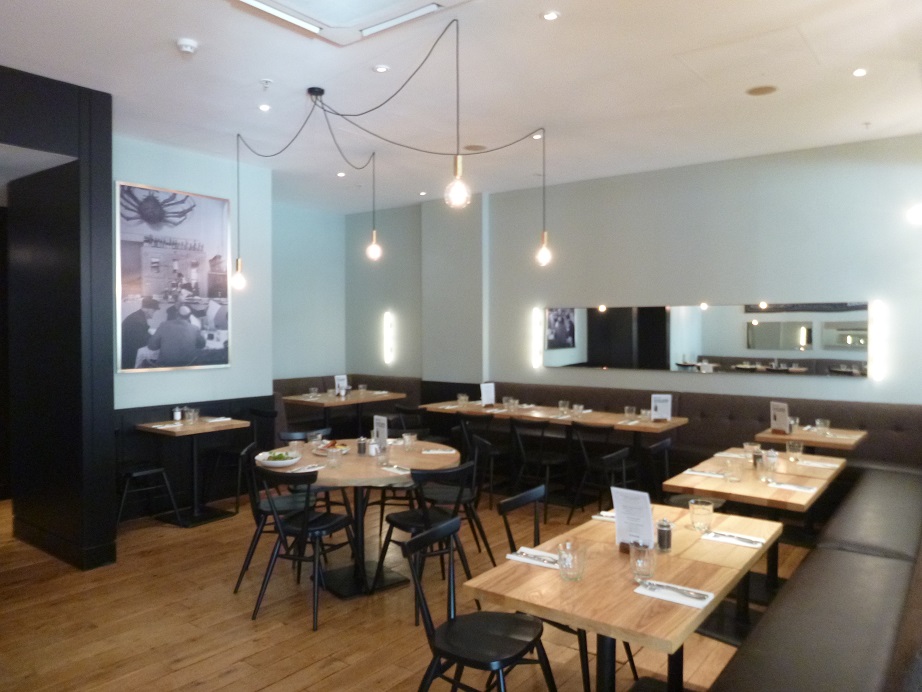 Semi-private dining area in Strada Dockside, perfect for intimate gatherings and corporate events. - Banner