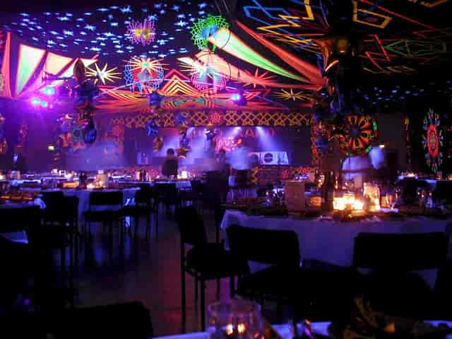 Bath Pavilion gala with immersive UV lighting and draping for corporate event decor.