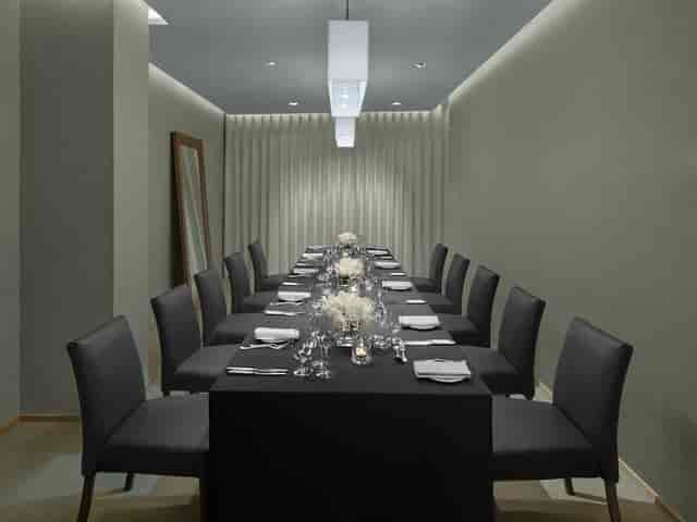 Modern meeting space in The London EDITION, ideal for intimate gatherings and discussions.