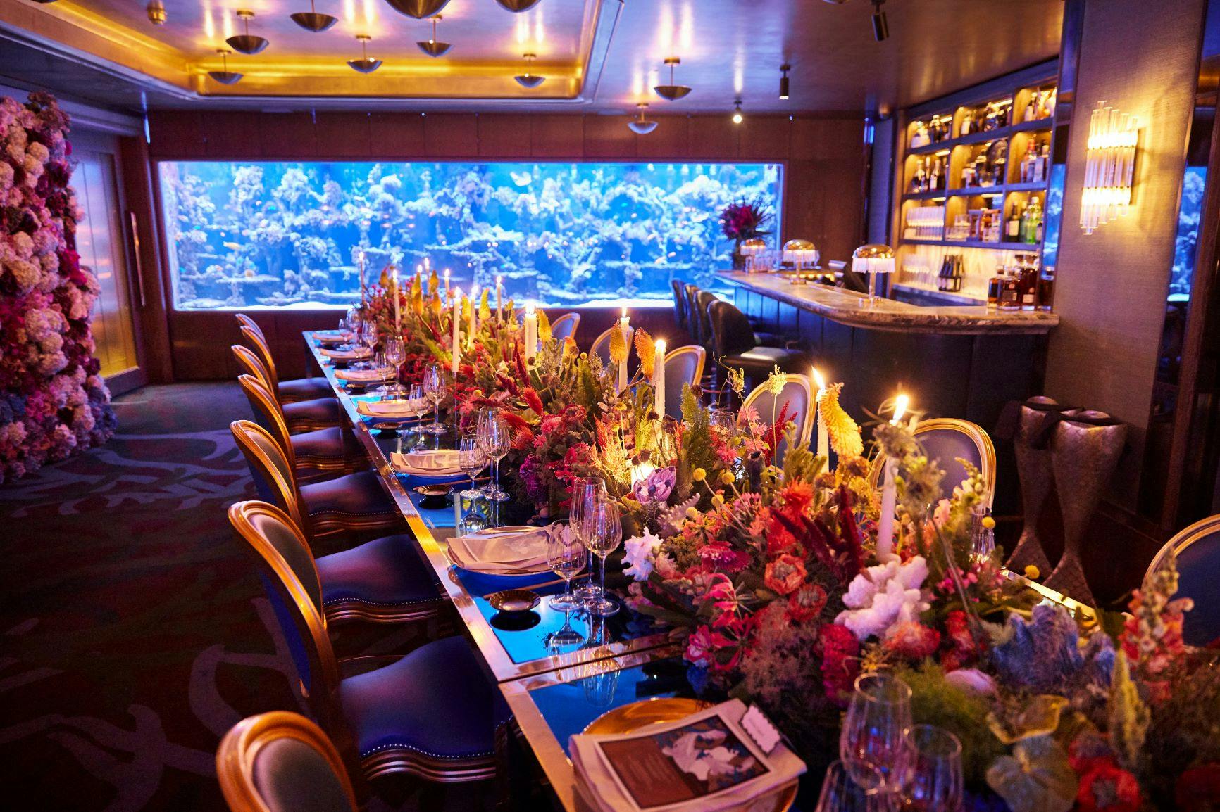 Elegant dining table in Coral Reef Room at Sexy Fish, perfect for upscale events.